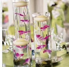 Qui n'a jamais été hypnotisé par la danse de jolis petits poissons rouges ? Mariage Blog Centre Table Mariage Poisson Rouge