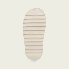 An outsole with accentuated grooves for traction and support completes the design. Adidas Yeezy Slides Bone Grailify