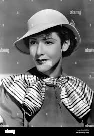 Mae Clarke modeling felt hat with slanted brim, 1934 Stock Photo