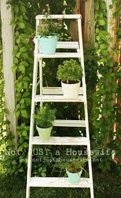 How To Reuse A Ladder As A Plant Stand 15 Ideas Shelterness Diy Plant Stand Diy Outdoor Decor Old Wooden Ladders Cut boards to slide from one side.