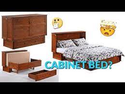 a cabinet that transforms into a queen bed watch the video below to learn how to turn a wardrobe into a big bed with people seeming cabinet bed bed queen beds