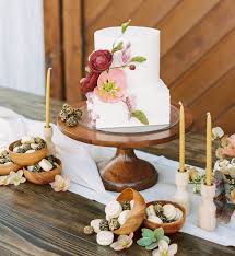 Real flowers add a touch of elegance and romance to your wedding white wedding cake on gold stand with pink and peach flowers. 15 Small Wedding Cakes That Are Perfect For A Micro Wedding