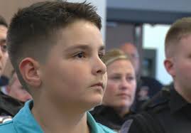 Cumberland police, fire, EMT adopt boy, 8, after battling brain tumor