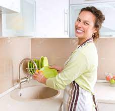 Most of which are told by her. Dishwashing Happy Young Woman Washing Dishes Stock Photo Picture And Royalty Free Image Image 14193491