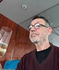 Doomed cruise liner that got stranded for four months in Belfast is dubbed  'SS Clusterf***' by passengers after being left without flushing toilets