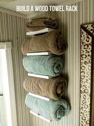 If you have a small bathroom, you'll need to maximize all the space you have, and one way to do that is to install a handy towel rack. Build A Diy Towel Storage Featuring Designs By Studio C Free And Easy Diy Project And Furniture Plans Wood Towel Rack Diy Towels Bathroom Towel Storage
