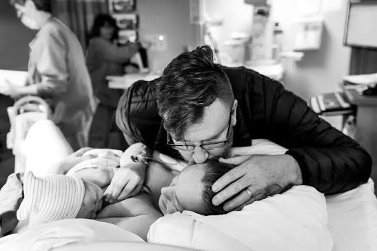Showing this first time dad his new born baby! Here at Queen's, we welcome  the husband inside the delivery room. To witness two miracles, the birth of  his child and the strength