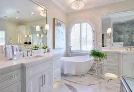 An outdoor japanese bathroom with a wooden soak tub, a planted tree and vases. Bathroom Remodel The Pool Brothers Blog