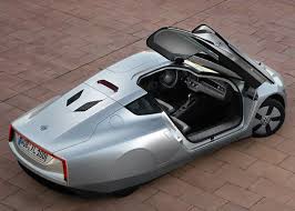 Volkswagen Xl1 Diesel Plug In Hybrid Limited Production Car 2013 Driver And Passenger Enter Via Butterfly Doors With 0 9 Volkswagen Fuel Efficient Cars Car