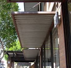 Houstonian metal standing seam awning (80 in. Wood Frame Match Of Matching Burnt Wood Corrugated Metal On Underside Metal Pergola Metal Awning Pergola