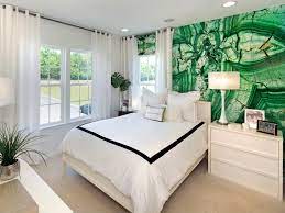 Green, gray and black primary bedroom color scheme. Decorating With Emerald Green Green Decorating Ideas Hgtv