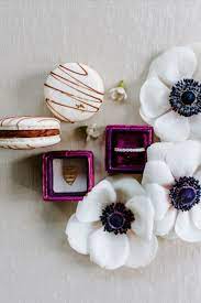 Iridescent Purple Ring Box With Espresso Drizzle Macaron With Platnium Diamond Wedding Band And White Anenome Diamond Wedding Bands Artisan Sweets Purple Rings
