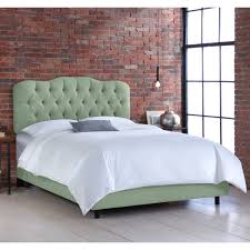 The bed is a platform bed, but the platform is a bookshelf which is wider than the bed itself. Skyline Swedish Blue Tufted Linen Bed