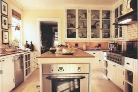 Upscale kitchen with granite island. Oven In Island Kitchen