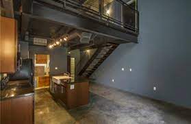 Features a beautiful spiral staircase leading up into the bedroom.(rlne4711346). Uptown Dallas Tx Lofts Split Level Apartments For Sale Rent Dfw Urban Realty