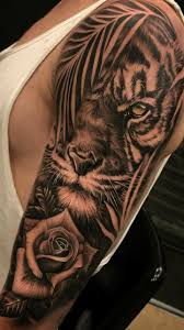 This powerful combo of the tiger and dragon tattoo says more than just strength and dominance as it is the one of the most power demonstrating designs that can be inked out of the various designs of the tiger tattoo gallery. Pin By Ashly Gourdin On Tattoo Ideas In 2020 Tiger Tattoo Sleeve Tiger Tattoo Design Mens Shoulder Tattoo
