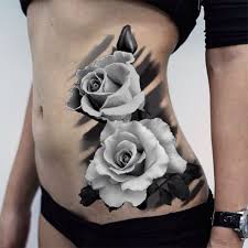 A flower tattoo can look equally as impressive in colour or black and white ink, as this design shows. White Rose Side Tattoo White Rose Tattoos Rose Tattoos Rose Tattoos For Women