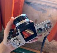 Nikon F com o visor de nível dos olhos e o visor de nível da ...