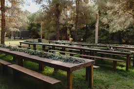 Farmhouse Tables Benches At Schnepf Farm Industrial Barn Wedding Farm Wedding Farmhouse Table With Bench