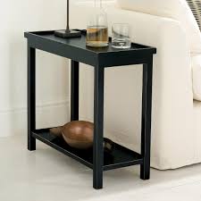 Sofa Side Table The curves and shiny finish aren't the thin top and base prevent the table from looking clunky, and the slightly asymmetrical shape.