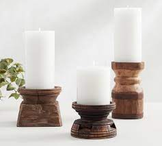 As an alternative to the first suggestion in this list, which uses birch logs standing vertically, you can cut them into longer pieces and drill tea light pockets into the sides of the bark, for a longer and shorter candle holder. Axel Eclectic Wood Candle Holders Pottery Barn