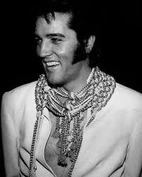 Hello, Elvis wearing White METAL EYE Jumpsuit which has a double row of  metal eyes
