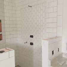 Cafe penny round tiles with brown edges ould be great for a late 60s or 70s bathroom floor or counter top. The Lantern Arabesque Tile Panel Is Up In Our Client S Steam Shower We Used Ceramic Inst Bathroom Shower Panels Arabesque Tile Bathroom Bathroom Shower Tile
