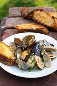 Grilled Clams And Mussels With Garlic Almonds And Mint Recipe Recipe Grilled Clams Nyt Cooking Cooking