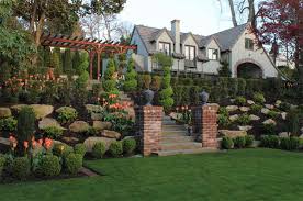 Storybook garden with romantic blooms and stately stonework 18 photos. Tips On How To Landscape On A Hill Home Design Lover
