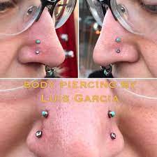 Both High Nostril Piercings By Luis Garcia Of Nokaoi Tiki Tattoo And Piercing Jewelry By Anatometal High Nostril Piercing Unique Body Piercings Piercing