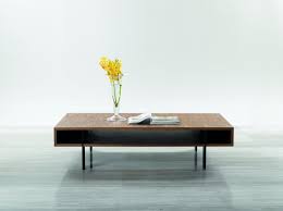 In fact, there are tons of different coffee table designs that can enhance your room effortlessly. Stilt Modern Walnut Coffee Table Las Vegas Furniture Store Modern Home Furniture Cornerstone Furniture