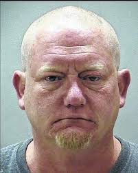 Father charged with intimidating a witness