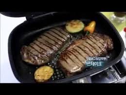 A flat surface and a riffled surface. Double Sided Grill Pan Youtube