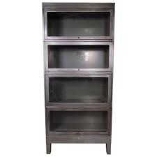 A barrister bookcase is a solid backed bookcase with self contained shelving units that can be modern styles can have glass doors or solid ones. Industrial Metal Finished Barrister Bookcase For Sale At 1stdibs
