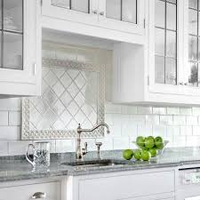 Subway Tile Backsplash With Pretty Insert Over Sink Backsplash Tile Design Kitchen Tiles Backsplash Stove Backsplash