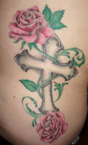 Memorial cross and poppy flower tattoo on forearm. Grey Cross With Roses Tattoo On Body For Women