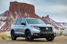 Sure, it has a different grille, big black wheels, chunkier roof rails and extra. 2021 Honda Passport Newcartestdrive