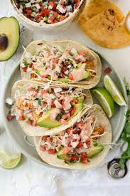 Place fried fish over warmed tortillas, topped with the marinated onions, white sauce, lime wedges, cabbage, pico de gallo, and cilantro. Air Fryer Baja Fish Tacos Simply Scratch