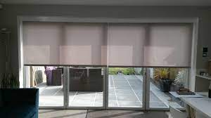 electric blinds covering your bifold doors will reduce unwanted heat glare and uv by deans blinds blinds for bifold doors house blinds roller blinds kitchen