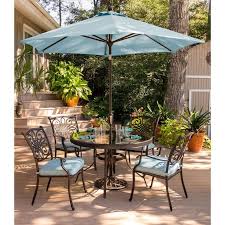 No matter your entertainment style, there's an outdoor dining set to complement every patio, from compact bistro options to large round tables. Envelor Hanover Patio Traditions Bronze 5 Piece Aluminum Round Outdoor Dining Set With Blue Cushions And Umbrella Traddn5pcg Su B The Home Depot Outdoor Patio Decor Outdoor Dining Set Patio Dining Set