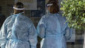 Victoria's covid response commander jeroen weimar with health staff outside the ariele apartment building in maribyrnong, melbourne. Vysirtuksu2f7m