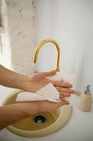 Person Drying Hands with Paper Towel · Free Stock Photo