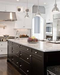 Brown kitchen cabinets with white island. One Color Fits Most Black Kitchen Cabinets