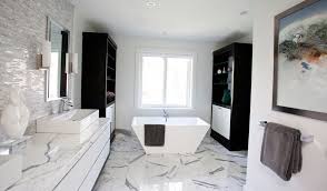 A luxurious white marble bathroom with sinks on stands, elegant black lamps and round mirrors. Sophisticated Bathroom Designs That Use Marble To Stay Trendy