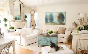 Whites and pastels are favorite colors and if fabric is new, it can be tea stained to create a worn, vintage look. Distressed Yet Pretty White Shabby Chic Living Rooms Home Design Lover
