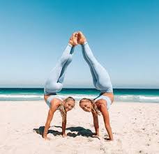 These yoga poses for two are perfect for beginner to intermediate yogis. The Rybka Twins Twins Instagram Twins Posing Twins