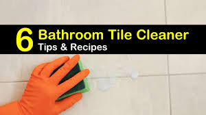 Scrub away at the floor and then wipe it dry for an effective bathroom tile cleaner. 6 Easy To Make Bathroom Tile Cleaner Recipes