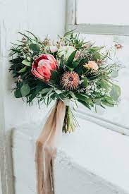 Protea Wedding Bouquet With Greenery And Ribbon Find Your Florist On Weddingwire Anna Wedding Flowers Bridal Bouquets Protea Wedding Flower Bouquet Wedding