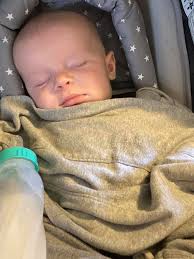 This is my first grandson. Do you think he is a little bit mad in the  pumpkin. Lol my Saint Bernard Hank thinks that Sorin is his baby ￼.