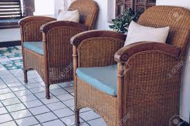 Rattan is a thin type of cane that grows around larger trees in the damp jungles of africa, malaysia and the philippines, and it's been used to make woven furniture for when cut into thin strips, the material can be intertwined into many different patterns, and the stronger inner core can be worked into wicker. Old Vintage Retro Wicker Rattan Armchair Chair On Terrace Balcony Stock Photo Picture And Royalty Free Image Image 140222832